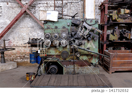 Heavy metal bending forming machine tool with rollers and control panel in an industrial plant 141732032