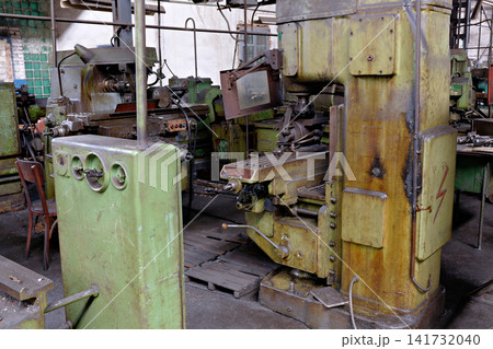 Heavy Duty Green Milling Machine with Control Panel in Old Factory Workshop 141732040