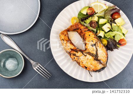 Grilled Trout Steak with Fresh Vegetable Salad 141732310