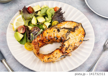 Healthy Trout Fillet Steak with Avocado and Green Salad 141732311