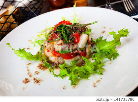 Cod timbale with roasted red peppers, rocket, olives 141733790