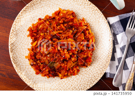 Delicious dish of stewed cabbage with pearl barley 141735950