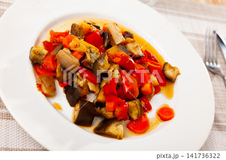 Dish with stewed vegetables and pepper Dish with stewed vegetables and pepper 141736322