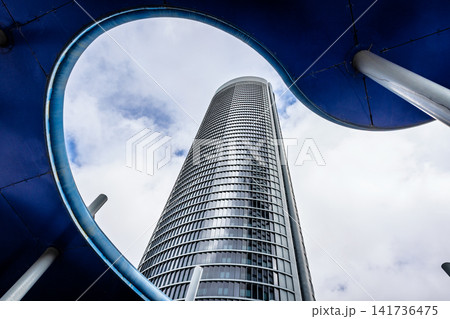Modern tower framed by architectural canopy, Madrid, Spain Modern tower framed by architectural canopy, Madrid, Spain 141736475