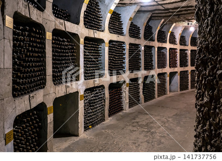 Huge bottle collection stored inside underground wine cellars tunnel Huge bottle collection stored inside underground wine cellars tunnel 141737756