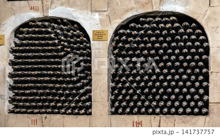 Huge bottle collection stored inside underground wine cellars tunnel Huge bottle collection stored inside underground wine cellars tunnel 141737757