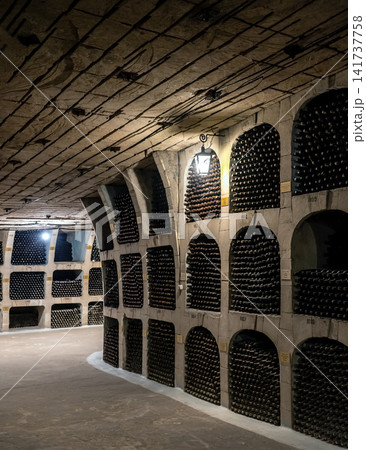Huge bottle collection stored inside underground wine cellars tunnel 141737758