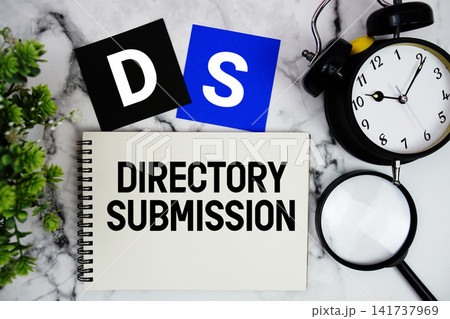 DS Directory Submission text written on notepad with alarm clock and magnifying glass on marble background DS Directory Submission text written on notepad with alarm clock and magnifying glass on marble background 141737969
