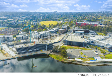 Aerial view of a residential construction site and surrounding buildings Aerial view of a residential construction site and surrounding buildings 141738207