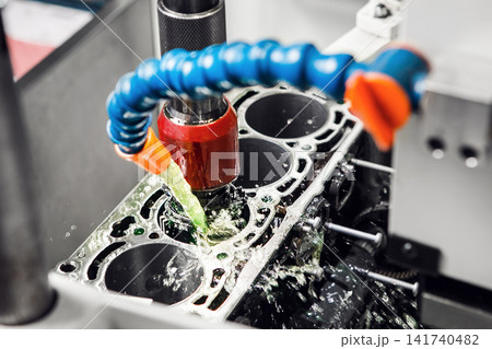 Work of Cylinder honing engine machine. Diamond boring of car details on CNC machine. Work of Cylinder honing engine machine. Diamond boring of car details on CNC machine. 141740482