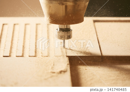 Cutting wood using a machine with numerical control. Cnc tool. Cutting wood using a machine with numerical control. Cnc tool. 141740485