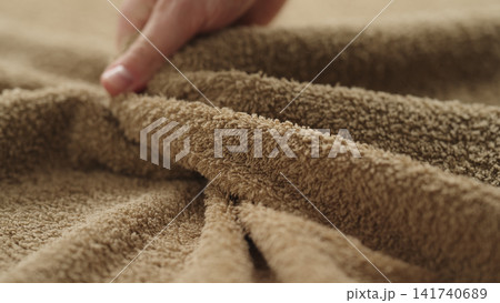 closeup shot of man touching green cotton terry towel closeup shot of man touching green cotton terry towel 141740689