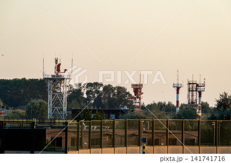 Airport Navigation Masts and Radar in the Distance Airport Navigation Masts and Radar in the Distance 141741716