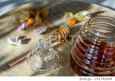 Honey Jar Dipper and Glass Bee Lid Detail Honey Jar Dipper and Glass Bee Lid Detail 141742084