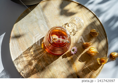 Top View of a Honey Jar with a Wooden Dipper Top View of a Honey Jar with a Wooden Dipper 141742097