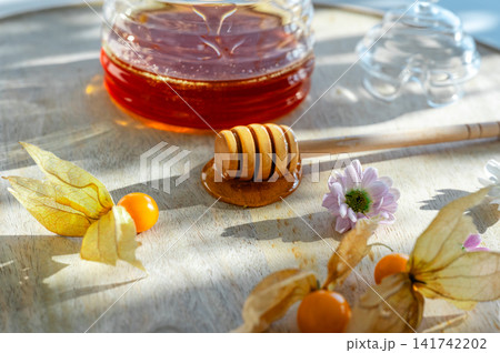 Honey Dipper Physalis and Flowers by a Jar Honey Dipper Physalis and Flowers by a Jar 141742202