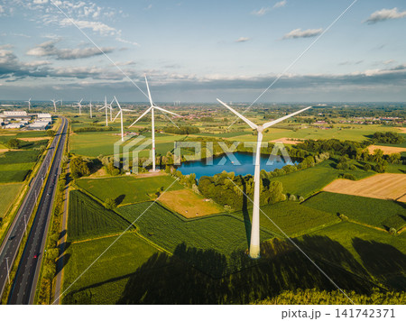 Aerial View of Wind Turbines Over Patchwork Fields Aerial View of Wind Turbines Over Patchwork Fields 141742371