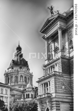 St. Stephen's Basilica Dome and Ornate Buildings Against Blue Sky 141743068
