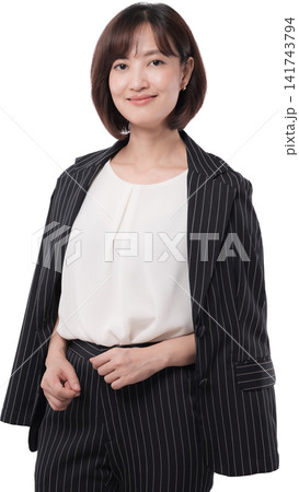 Confident happy asian woman executive standing wearing dark suit showing friendly smile expression isolated transparency background Confident happy asian woman executive standing wearing dark suit showing friendly smile expression isolated transparency background 141743794