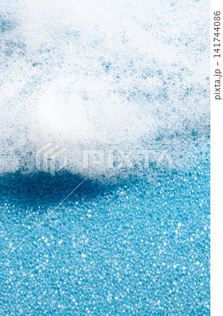 Soap foam or dish detergent on a sponge. Copy space Soap foam or dish detergent on a sponge. Copy space 141744086