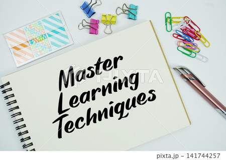 Master Learning Techniques text message written on notepad with stationery flat lay on white background Master Learning Techniques text message written on notepad with stationery flat lay on white background 141744257