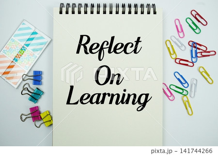 Reflect On Learning text message written on notepad with stationery flat lay on white background Reflect On Learning text message written on notepad with stationery flat lay on white background 141744266