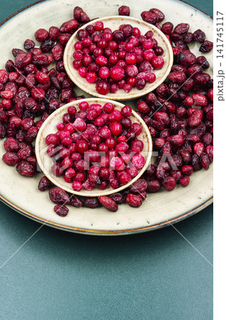 Red Cranberry Berries on Plate with Frozen and Dried Fruit Red Cranberry Berries on Plate with Frozen and Dried Fruit 141745117