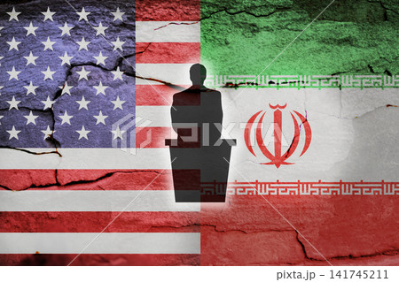 Conceptual image representing US-Iran relations with political flags of the United States and Iran, textured wall background, and a speaker silhouette Conceptual image representing US-Iran relations with political flags of the United States and Iran, textured wall background, and a speaker silhouette 141745211