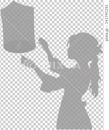 silhouette of a person releasing a sky lantern silhouette of a person releasing a sky lantern 141745291