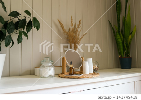 Gua sha stone, facial serum dropper bottle for skincare routine. Makeup mirror, cotton pads jar, dried grass. Eco Friendly Vanity Table Aesthetics. Mindful Self Care, Slow Living. Facial Massage Tools Gua sha stone, facial serum dropper bottle for skincare routine. Makeup mirror, cotton pads jar, dried grass. Eco Friendly Vanity Table Aesthetics. Mindful Self Care, Slow Living. Facial Massage Tools 141745419