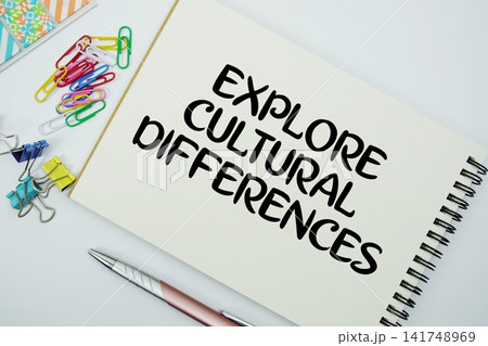 Explore Cultural Differences text message written on notepad with stationery flat lay on white background Explore Cultural Differences text message written on notepad with stationery flat lay on white background 141748969