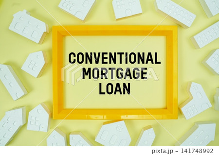 Conventional Mortgage Loan text with house models on yellow background Conventional Mortgage Loan text with house models on yellow background 141748992