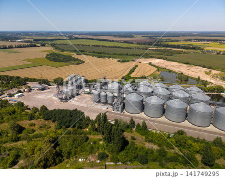 Panoramic Drone View of Industrial Silo Storage Infrastructure and Farmland Panoramic Drone View of Industrial Silo Storage Infrastructure and Farmland 141749295