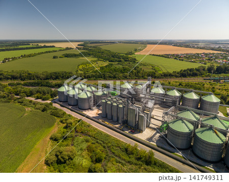 Panoramic Drone View of Industrial Grain Elevator Silos in Rural Farmland 141749311