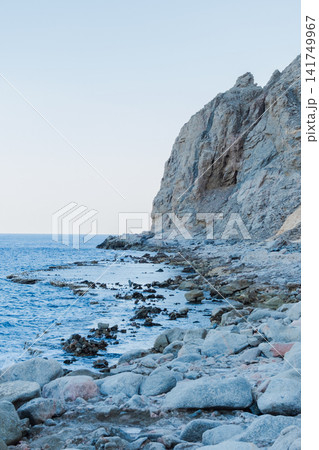 Natural pools along the Red Sea coast in Dahab, Egypt. Rocky shoreline under the Sinai mountains with clear blue water. Natural pools along the Red Sea coast in Dahab, Egypt. Rocky shoreline under the Sinai mountains with clear blue water. 141749967