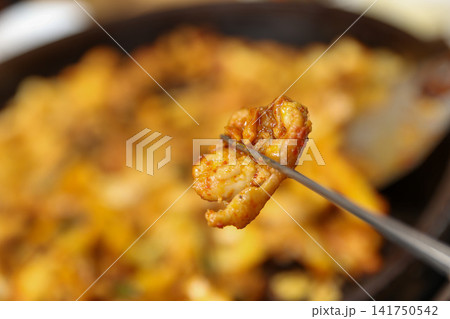 Spicy Korean Chicken Stir Fry Dakgalbi with Vegetables on Iron Pan 141750542