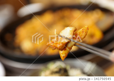 Spicy Korean Chicken Stir Fry Dakgalbi with Vegetables on Iron Pan Spicy Korean Chicken Stir Fry Dakgalbi with Vegetables on Iron Pan 141750545
