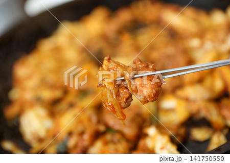 Spicy Korean Chicken Stir Fry Dakgalbi with Vegetables on Iron Pan Spicy Korean Chicken Stir Fry Dakgalbi with Vegetables on Iron Pan 141750550