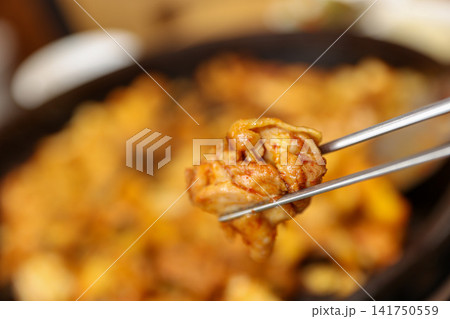 Spicy Korean Chicken Stir Fry Dakgalbi with Vegetables on Iron Pan Spicy Korean Chicken Stir Fry Dakgalbi with Vegetables on Iron Pan 141750559
