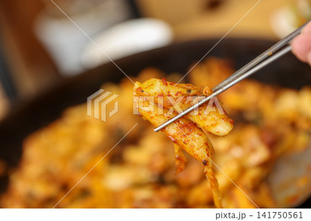 Spicy Korean Chicken Stir Fry Dakgalbi with Vegetables on Iron Pan Spicy Korean Chicken Stir Fry Dakgalbi with Vegetables on Iron Pan 141750561