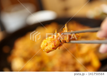 Spicy Korean Chicken Stir Fry Dakgalbi with Vegetables on Iron Pan 141750564
