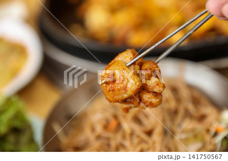 Spicy Korean Chicken Stir Fry Dakgalbi with Vegetables on Iron Pan Spicy Korean Chicken Stir Fry Dakgalbi with Vegetables on Iron Pan 141750567