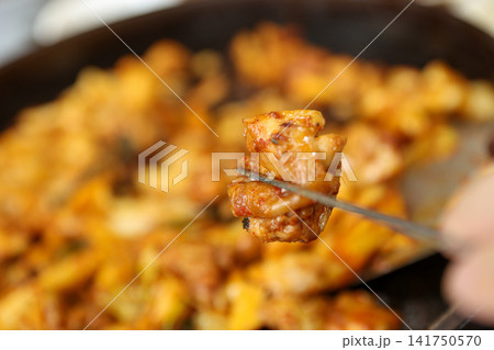 Spicy Korean Chicken Stir Fry Dakgalbi with Vegetables on Iron Pan Spicy Korean Chicken Stir Fry Dakgalbi with Vegetables on Iron Pan 141750570