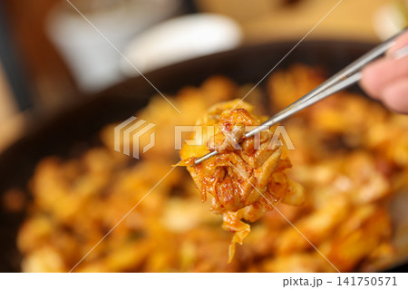 Spicy Korean Chicken Stir Fry Dakgalbi with Vegetables on Iron Pan Spicy Korean Chicken Stir Fry Dakgalbi with Vegetables on Iron Pan 141750571