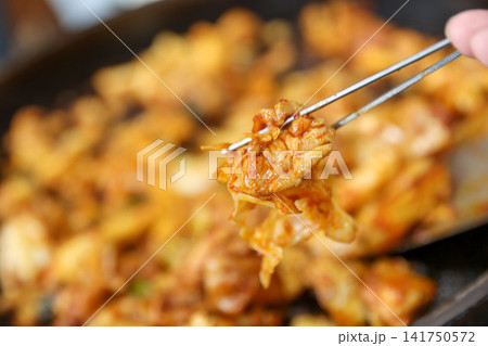 Spicy Korean Chicken Stir Fry Dakgalbi with Vegetables on Iron Pan 141750572