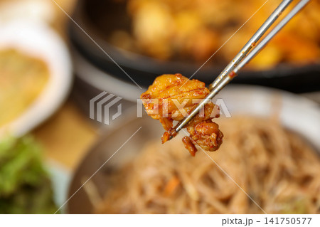 Spicy Korean Chicken Stir Fry Dakgalbi with Vegetables on Iron Pan 141750577