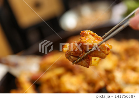 Spicy Korean Chicken Stir Fry Dakgalbi with Vegetables on Iron Pan Spicy Korean Chicken Stir Fry Dakgalbi with Vegetables on Iron Pan 141750587