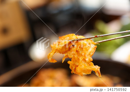Spicy Korean Chicken Stir Fry Dakgalbi with Vegetables on Iron Pan 141750592