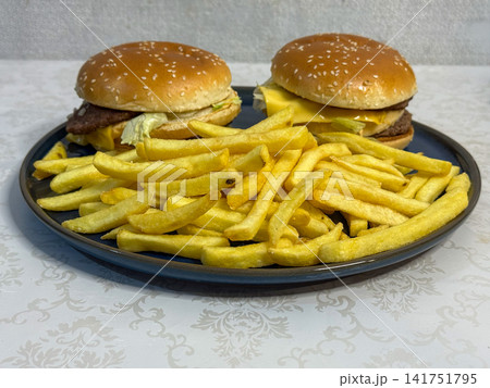 Cheeseburgers With French Fries Cheeseburgers With French Fries 141751795