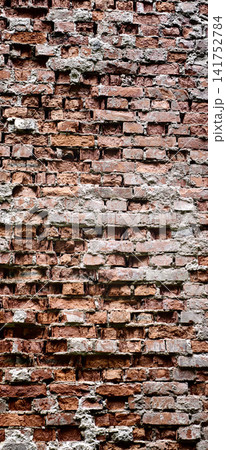 Old brick wall with varied textures in a urban setting during daylight Old brick wall with varied textures in a urban setting during daylight 141752784